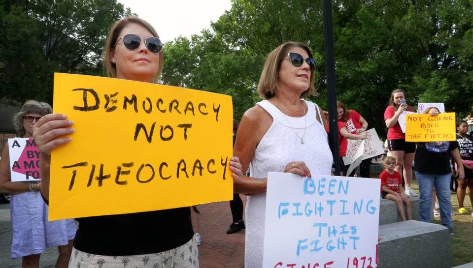 People gather in downtown Columbus Thursday evening to protest the recent U.S. Supreme Court’s decision about abortion rights. 06/30/2022