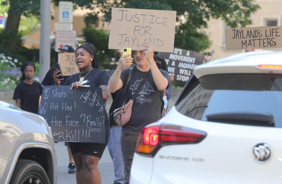 Protesters block traffic to the Stubbs Justice Center June 30 in downtown Akron during a protest over the police shooting death of Jayland Walker.