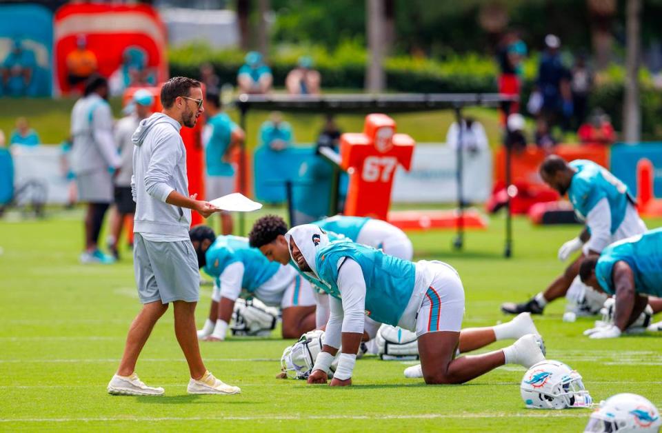Miami Dolphins head coach Mike McDaniel talks with Dolphins linebacker Bradley Chubb (2) during NFL football training camp at Baptist Health Training Complex in Hard Rock Stadium on Thursday, August 3, 2023 in Miami Gardens, Florida.