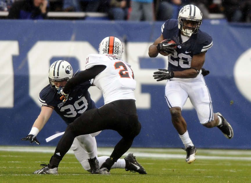 BYU running back Adam Hine bounces outside a block during a game at LaVell Edwards Stadium on Saturday, November 16, 2013. | Matt Gade, Deseret News