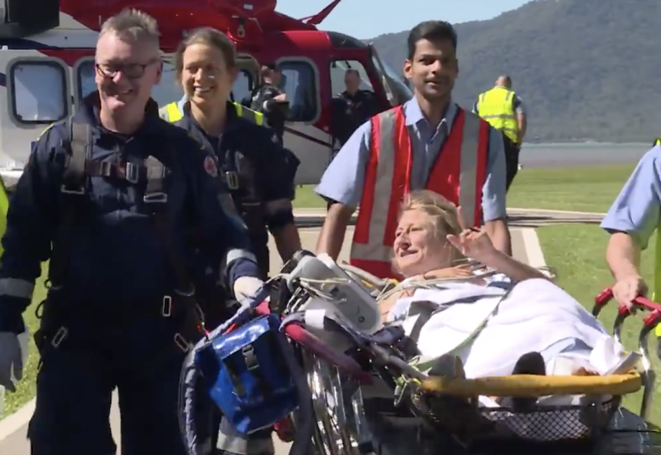 Photo shows shark attack victim in a stretcher arriving at Cairns Hospital. 