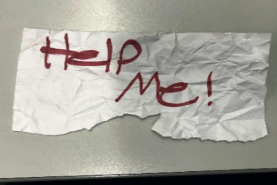 In this undated photo released by the U.S Department of Justice is a "Help Me!" sign used by a 13-year-old girl kidnapped in Texas. The girl was rescued in Southern California on July 9, 2023, when passersby saw her hold up the sign in a parked car, police said. The rescue occurred in Long Beach when officers responded to a trouble call and found the "visibly emotional and distressed girl," police said in a press release Thursday, July 20.