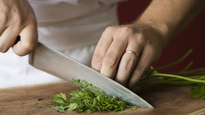 Chopping cilantro on board