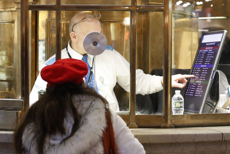 A traveler receives assistance at an information window in Grand Central Terminal in New York City, Dec. 2023. Around 115 million people in the U.S. were expected to travel by car or plane over the 10-day holiday period at the time. File photo by John Angelillo/UPI