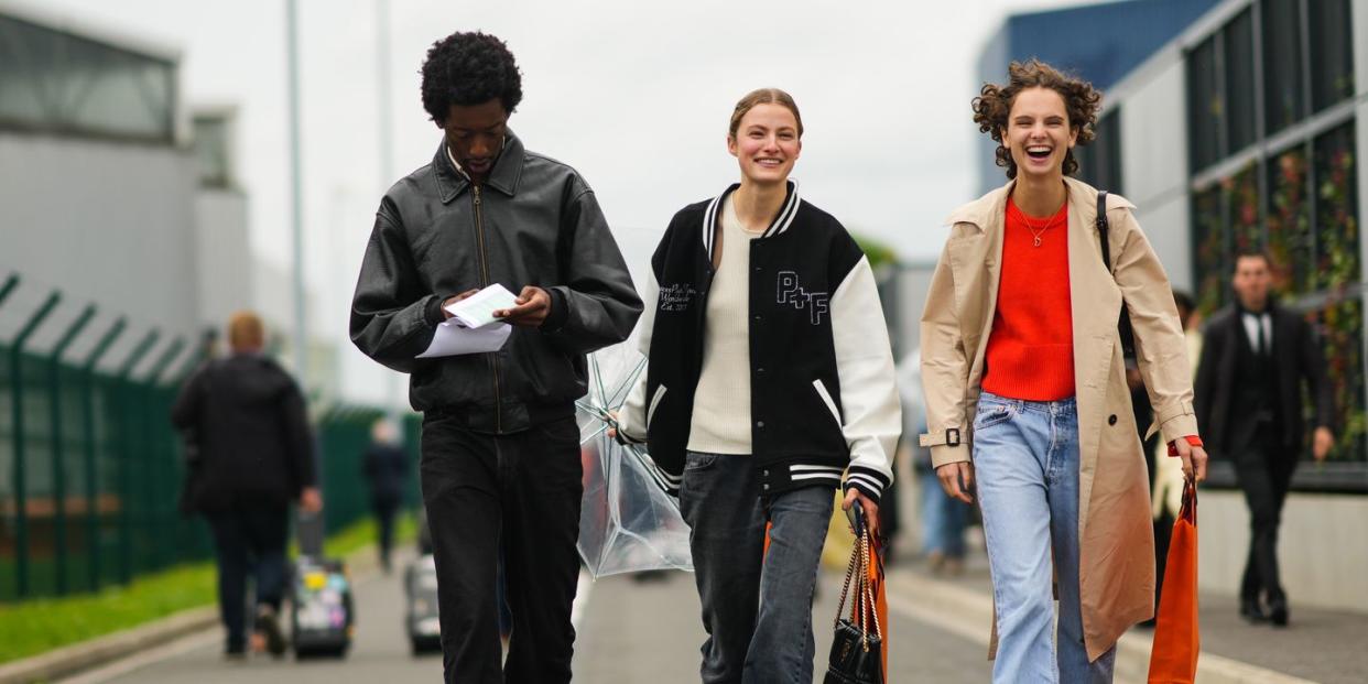 a group of people wearing casual clothes and carrying shopping bags to illustrate a guide to the nordstrom anniversary sale fashion deals for 2023