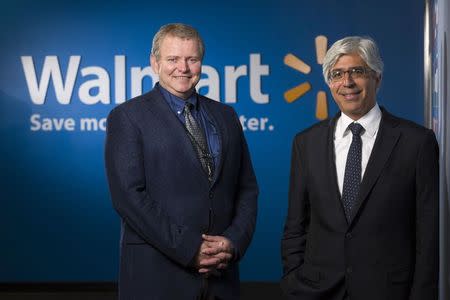 Michael Bennett (L), senior vice president and general counsel in the litigation division of Wal-mart Stores, and Theodore J. Boutrous, Jr., counsel with Gibson, Dunn and Crutcher in Los Angeles, meet at the Wal-mart headquarters in Bentonville, Arkansas November 4, 2014. REUTERS/Marc F. Henning