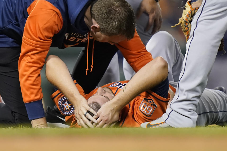 Houston Astros' Jake Odorizzi (17) is tended to on the mound after the fifth inning of a baseball game against the Boston Red Sox, Monday, May 16, 2022, in Boston. (AP Photo/Steven Senne)