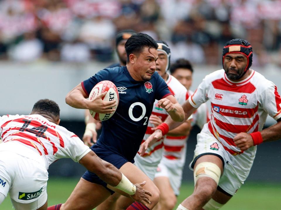 England fly-half Marcus Smith on his way to score a try against Japan at the National Stadium in Tokyo (EPA)