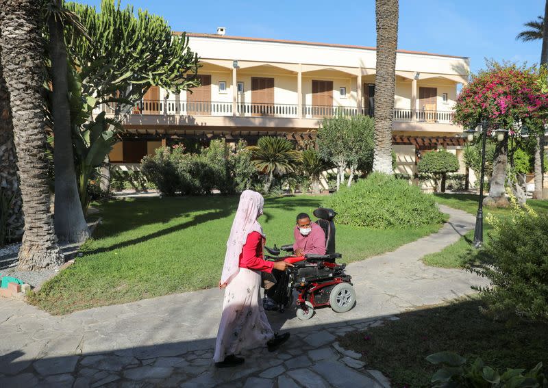 Migrants are seen inside the Franciscan monastery next to the Church of Holy Cross near the United Nations buffer zone in Nicosia