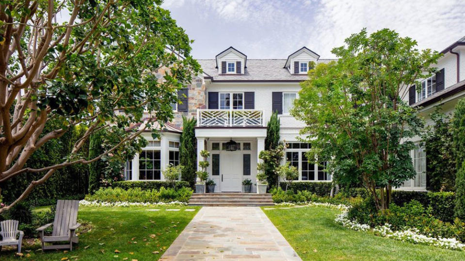 The front yard of the white brick and stone mansion. - Credit: Realtor.com