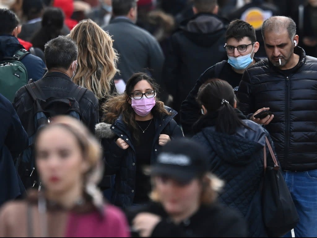 The WHO warned that the pandemic will last into 2022  (REUTERS)