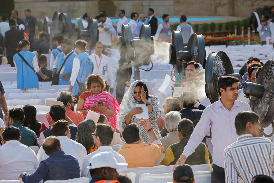 A crowd gathers in the heat for Modi's swearing-in ceremony