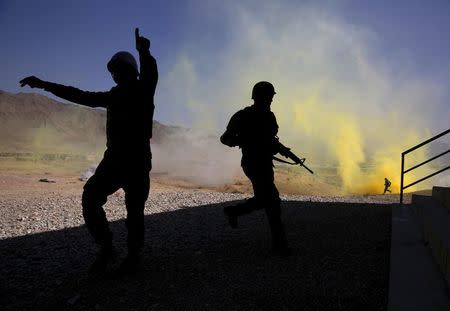 Afghan National Army (ANA) officers participate in a training exercise at the Kabul Military Training Centre in Afghanistan, in this October 7, 2015 file photo. REUTERS/Ahmad Masood/Files