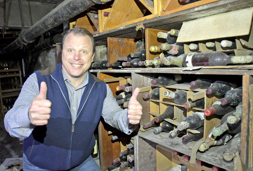 Auctioneer Paul Zekos inside the wine cellar of the historic 113-year-old Sterling Inn Restaurant and Hotel, which will be auctioned off on Friday.