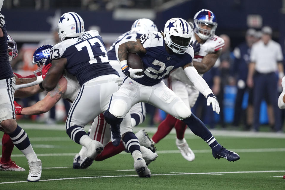 Dallas Cowboys running back Ezekiel Elliott (21) runs for a gain against the New York Giants during the second half of an NFL football game Thursday, Nov. 24, 2022, in Arlington, Texas. (AP Photo/Tony Gutierrez)