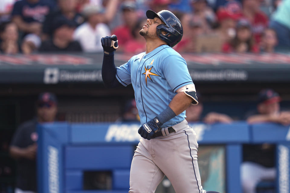 Tampa Bay Rays' Rene Pinto gestures as he runs to home plate with a home run in the third inning of a baseball game against the Cleveland Guardians, Sunday, Sept. 3, 2023, in Cleveland. (AP Photo/Sue Ogrocki)