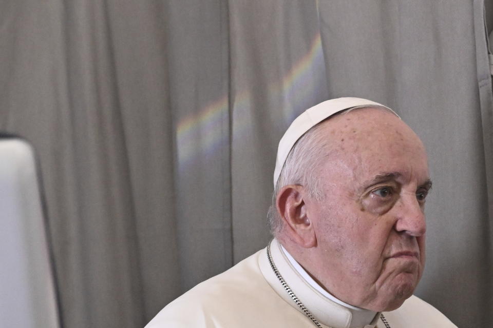 Pope Francis meets the journalists during an airborne press conference aboard the airplane directed to Rome, at the end of his pastoral visit to Congo and South Sudan, Sunday, Feb. 5, 2023. (Tiziana Fabi/Pool Photo Via AP)