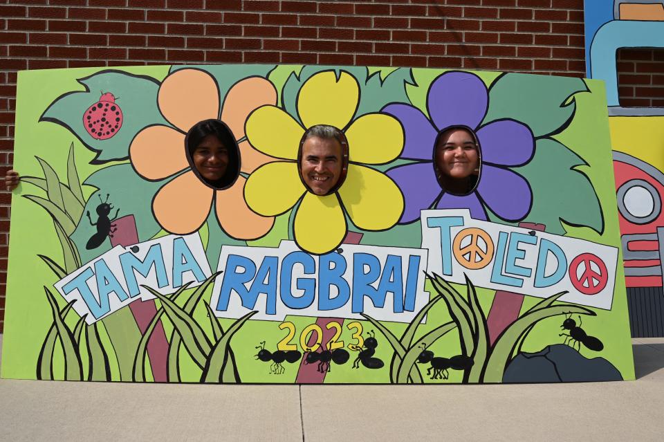 From left to right: Jesse Ordaz, Eric Rosario and Arianna Herrera interact with some of the art that will be in Tama-Toledo for RAGBRAI.