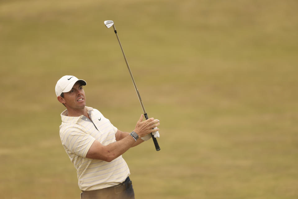 Rory McIlroy of Northern Ireland plays a shot on the 13th hole during the final round of the British Open golf championship on the Old Course at St. Andrews, Scotland, Sunday July 17, 2022. (AP Photo/Peter Morrison)