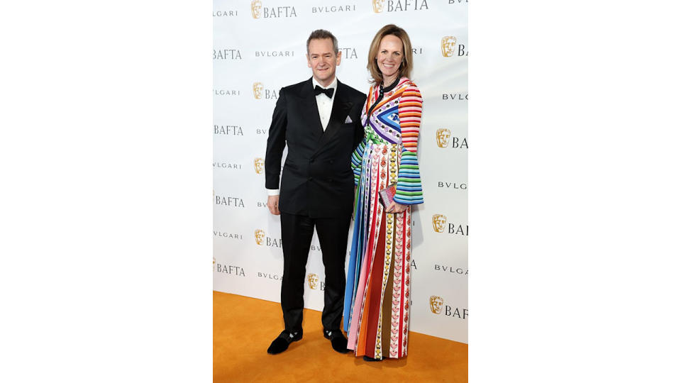 Alexander with his wife, Hannah on the orange carpet for a BAFTA dinner