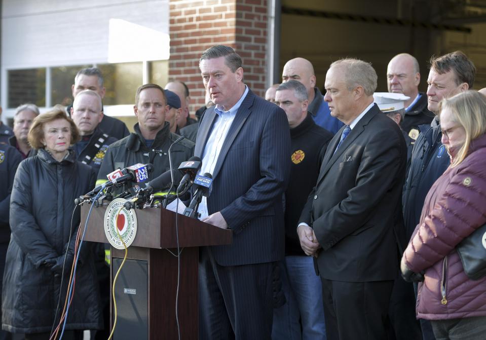 City Manager Edward Augustus speaks to the media at Worcester Fire Department Headquarters, Wednesday, Nov. 13, 2019 after the death of Lt. Jason Menard in an overnight in Worcester, Mass. Menard, 39, and his crew became trapped on the top floor of the three-story home after the fire was reported at about 1 a.m., Worcester Fire Chief Michael Lavoie told a news conference. Menard helped two members of his crew escape but he himself was unable to get out. (Christine Peterson/Worcester Telegram & Gazette via AP)
