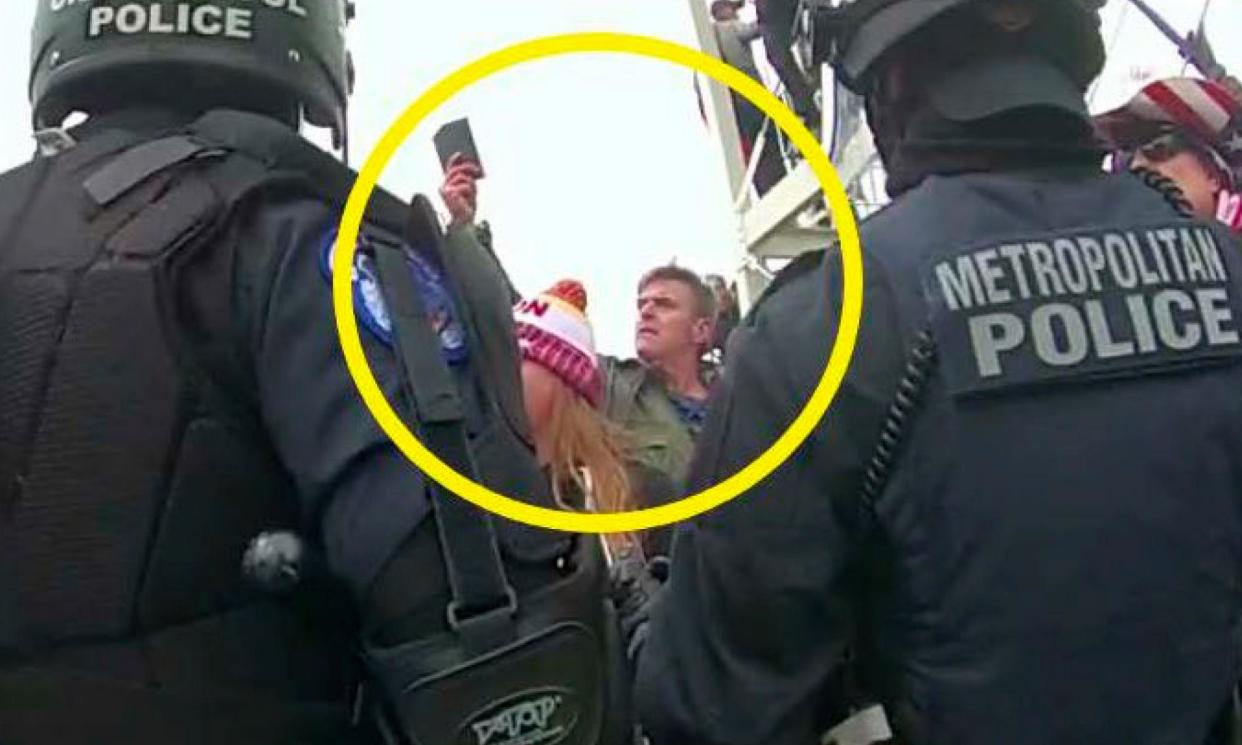 <span>Police video shows Jay Johnston, circled in yellow, on 6 January 2021.</span><span>Photograph: AP</span>