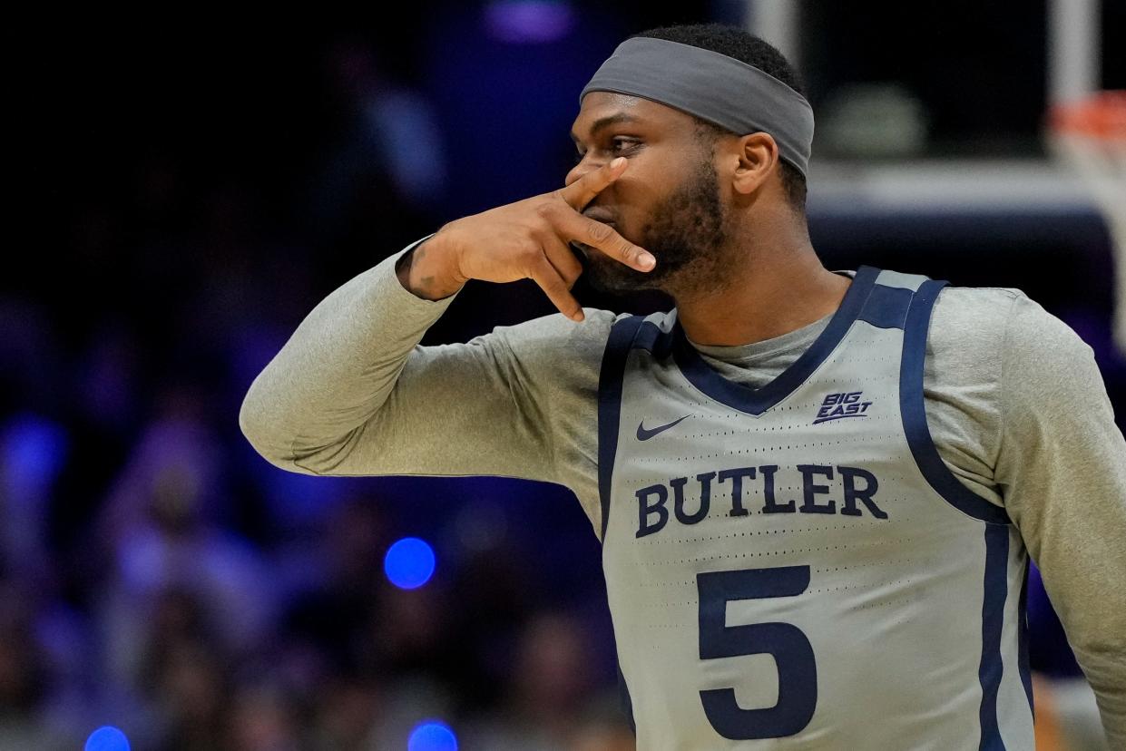 Butler Bulldogs guard Posh Alexander (5) gestures toward the Xavier Musketeers bench after sinking a three point basket in the second half of the NCAA Big East basketball game between the Xavier Musketeers and the Butler Bulldogs at the Cintas Center in Cincinnati on Tuesday, Jan. 16, 2024. The Musketeers won 85-71.