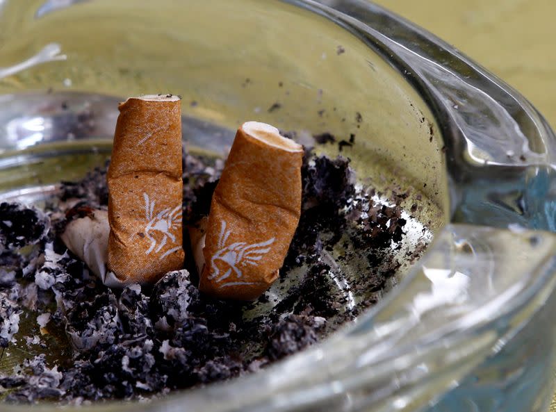 FILE PHOTO: An illustration picture shows discarded Gauloises cigarette butts in an ashtray in a coffee house in Vienna