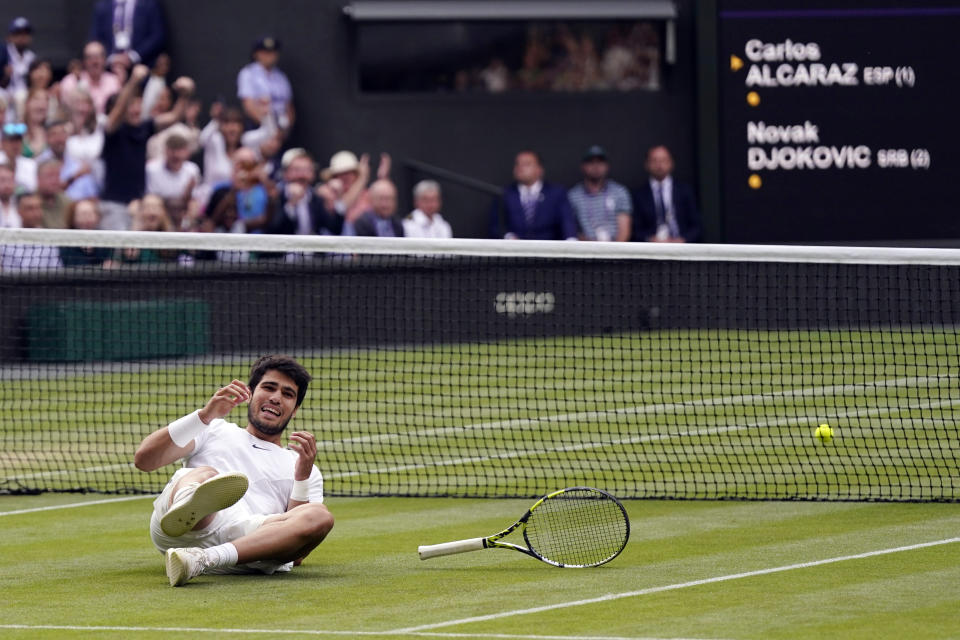 Carlos Alcaraz exults in a Wimbledon victory. (AP Photo/Alberto Pezzali)