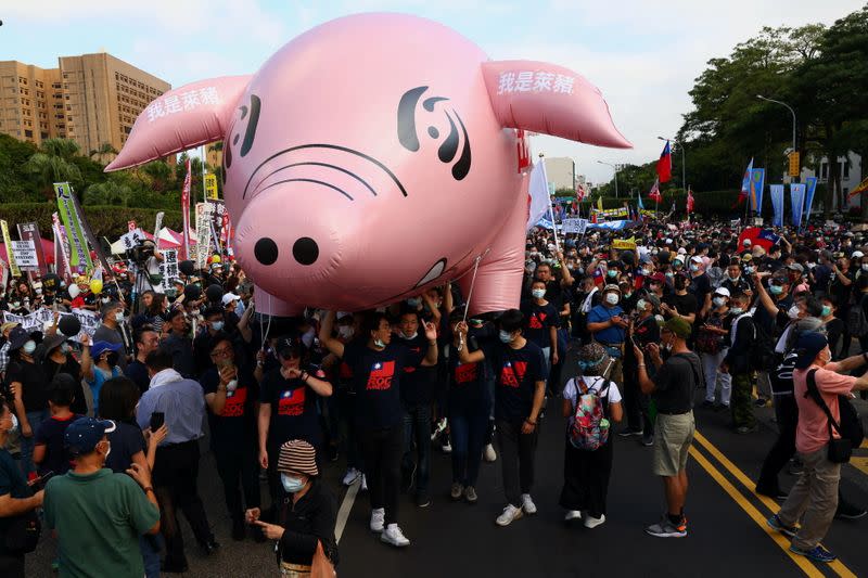 People join a protest to oppose the import of U.S. pork containing ractopamine, an additive that enhances leanness in Taipei