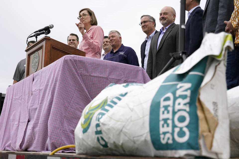 FILE - Iowa Gov. Kim Reynolds speaks before signing the Biofuels Bill, May 17, 2022, in Prairie City, Iowa. More Republican state lawmakers are losing their primaries this year than in any other election over the past decade, dispatched by far-right challengers who say the incumbents are not conservative enough. Next up is Wisconsin, where both Republican legislative leaders are among several incumbents facing primary challenges. (AP Photo/Charlie Neibergall, File )