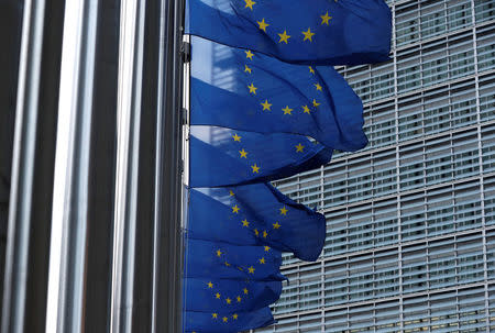 European Union flags flutter outside the EU Commission headquarters in Brussels, Belgium, March 8, 2018. REUTERS/Yves Herman