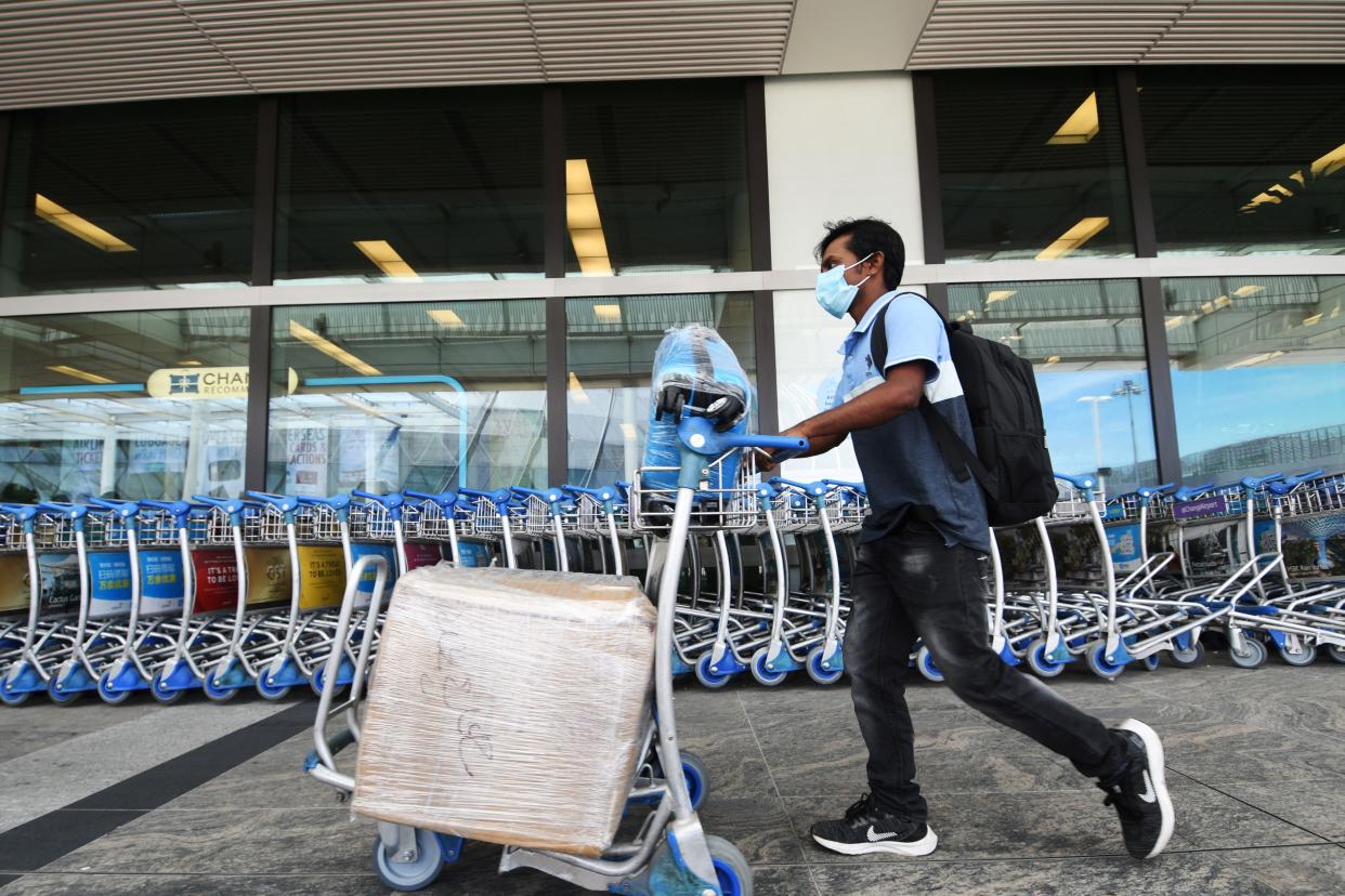 A man seen outside the departure hall of Changi Airport in Singapore on 19 August, 2021.(PHOTO: Xinhua via Getty Images)