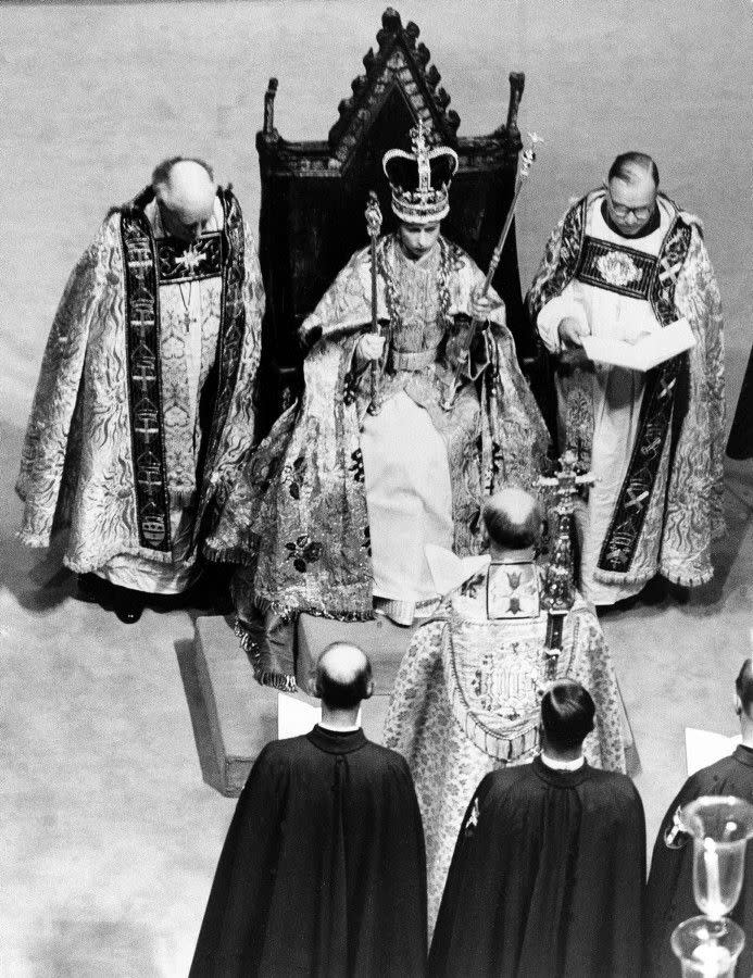 Her royal highness Queen Elizabeth II takes the throne after receiving the crown, scepter and rod from the Archbishop of Canterbury at Westminster on June 2, 1953. The coronation ceremony was the first service of its kind to be televised. More than 27 million people are said to have tuned in.
