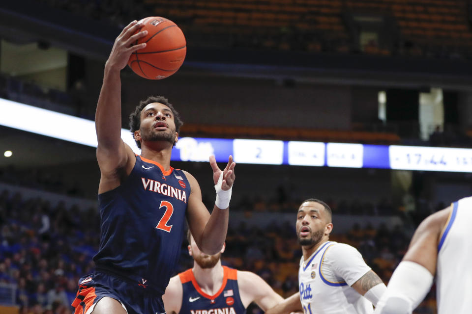 Virginia's Braxton Key (2) shoots after getting by Pittsburgh's Terrell Brown, right, during the first half of an NCAA college basketball game, Saturday, Feb. 22, 2020, in Pittsburgh. (AP Photo/Keith Srakocic)