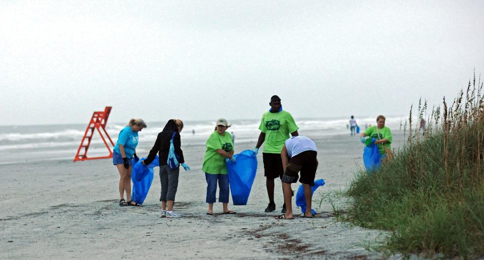 Volunteers cleaning up a stretch of Jacksonville Beach during a recent International Coastal Cleanup.