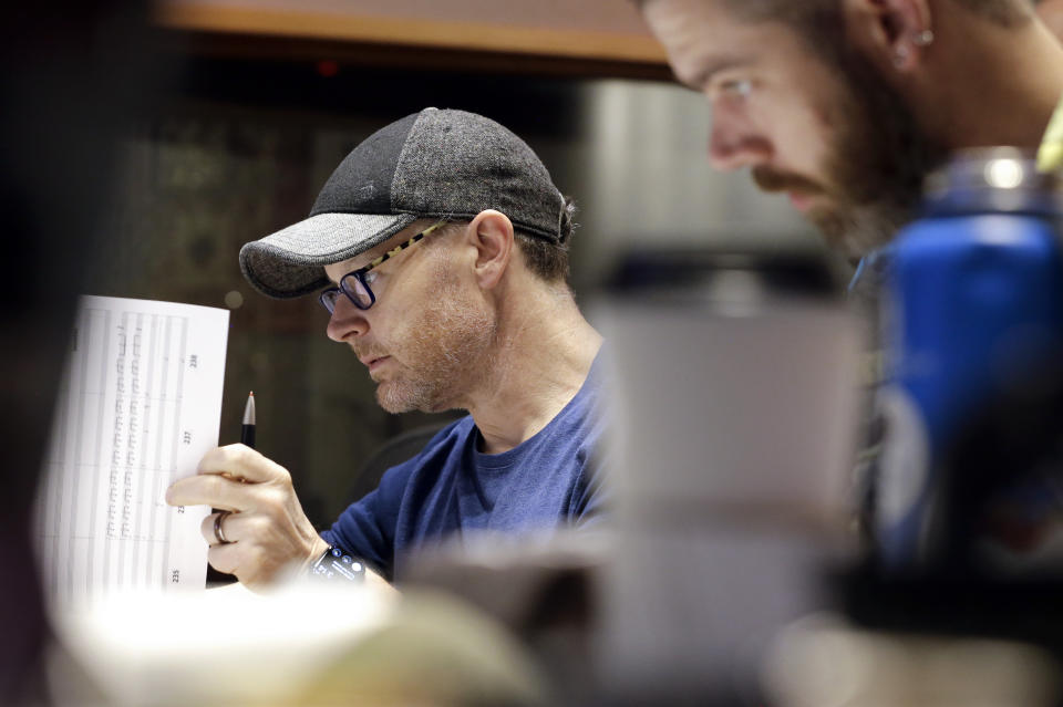 In this Oct. 21, 2019, photo, composer Gordy Haab, left, oversees the recording of his video game soundtrack with the help of Sam Smythe, right, in Nashville, Tenn. Music City is earning a new reputation as Soundtrack City. And more production companies, including Netflix, Showtime, Sony and Focus Features, have been lured to Nashville to record music for movies, TV and video games in the last year thanks to a new incentive program. (AP Photo/Mark Humphrey)