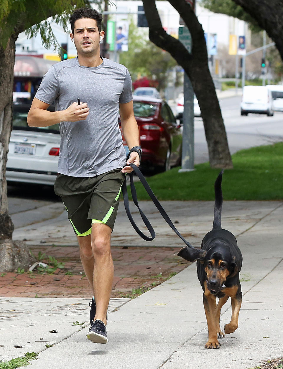 <p>Wells Adams goes for a run with his dog on Tuesday in L.A. </p>