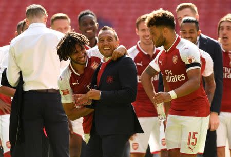 Soccer Football - Chelsea vs Arsenal - FA Community Shield - London, Britain - August 6, 2017 Arsenal's Santi Cazorla and Mohamed Elneny celebrate with teammates after the match Action Images via Reuters/Tony O'Brien