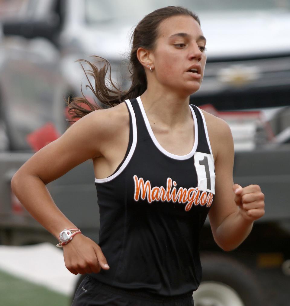 Marlington's Bella Graham during the girls 1600-meter final at the Division II district track and field finals at Salem Sebo Stadium on Saturday, May 21, 2022.