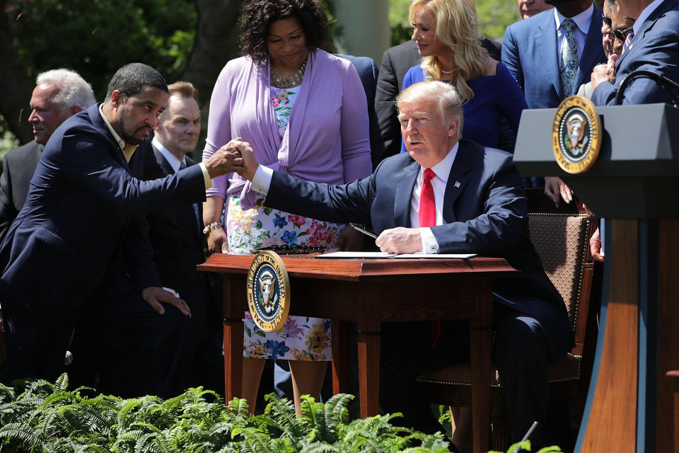 Pastor Darrell Scott and President Donald Trump shake hands at the the National Day of Prayer ceremony in the White House Rose Garden. (Photo: Chip Somodevilla via Getty Images)