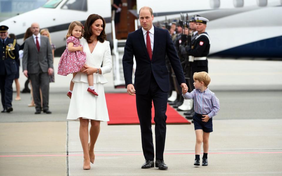 The Duke and Duchess of Cambridge and their children arrive on the runway at Warsaw - Credit: BARTLOMIEJ ZBOROWSKI/EPA