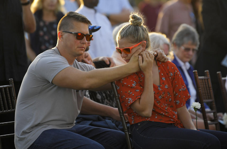 Attendees grieve during a vigil Friday, Sept. 6, 2019, in Santa Barbara, Calif., for the victims who died aboard the dive boat Conception. The Sept. 2 fire took the lives of 34 people on the ship off Santa Cruz Island off the Southern California coast near Santa Barbara. (AP Photo/Mark J. Terrill)