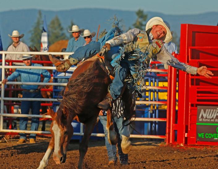 Mat David Turner from Australia attempts to stay on the horse in the bareback riding competition. Friday, July 2, 2021, kicked off the 30-year anniversary of the Eugene Pro Rodeo as crowds returned to the arena for the first time in a year and a half for family night and July 4 weekend.  