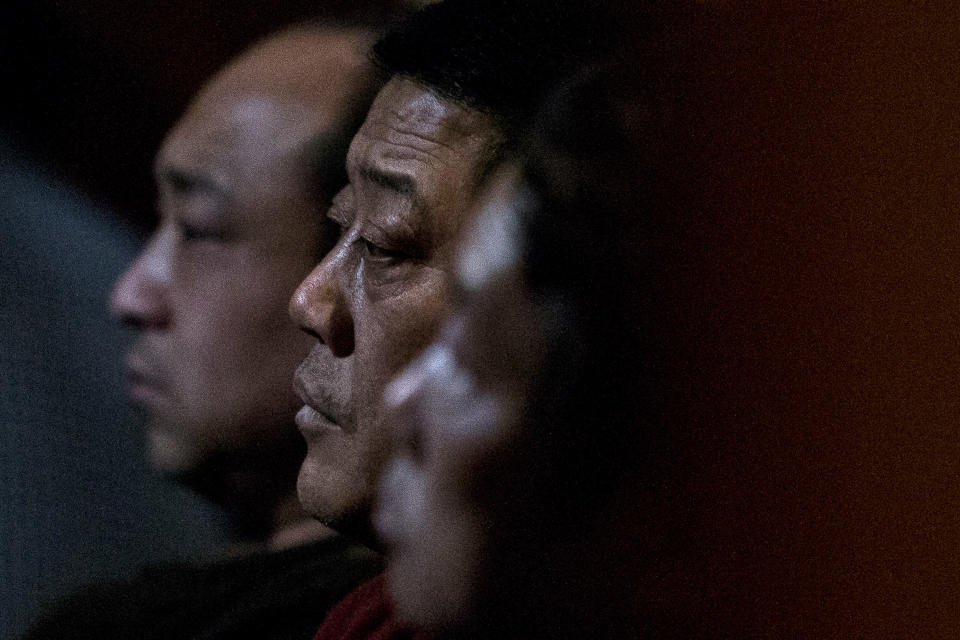 Relatives of Chinese passengers aboard missing Malaysia Airlines Flight MH370 watch a TV news program about the missing flight as they wait for official updates from Malaysia Airlines at a hotel ballroom in Beijing, China, Tuesday, March 11, 2014. Nearly three days after the Boeing 777 with 239 people on board disappeared en route from Kuala Lumpur to Beijing, no debris has been seen in Southeast Asian waters. (AP Photo/Alexander F. Yuan)