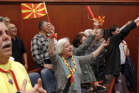 Protesters entered Macedonia's parliament after the governing Social Democrats and ethnic Albanian parties voted to elect an Albanian as parliament speaker in Skopje. Macedonia April 27, 2017. REUTERS/Ognen Teofilovski