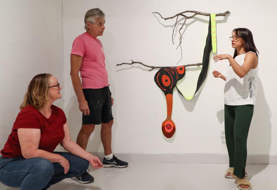 Artist Fl&#xe1;via Lima do R&#xea;go Monteiro, left, talks about her work &#x00201c;Como Voc&#xea;&quot; with curator Susan Myrland, left, and executive director Bill Schinsky at the Coachella Valley Art Center in Indio, Calif., March 25, 2022.