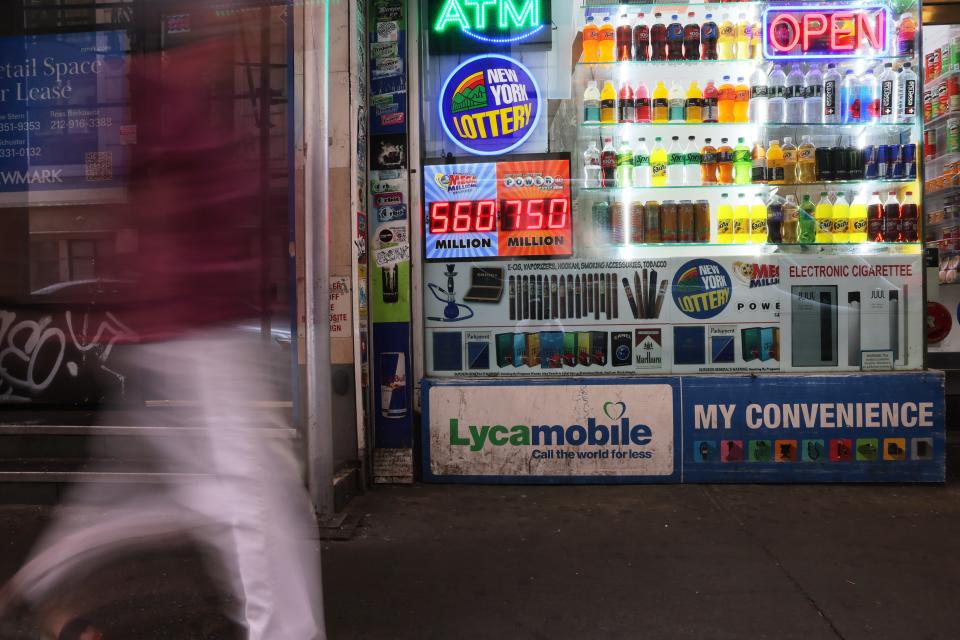 A Powerball and Mega Millions lottery advertisement is displayed at a convenience store on July 12 in New York City.