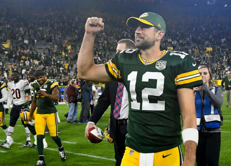 Packers quarterback Aaron Rodgers celebrates after beating the Bears at Lambeau Field.