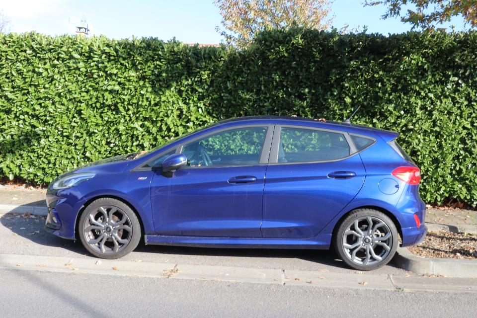 Ford Fiesta, 4-door blue sedan car, town of Corbas, Rhône department, France